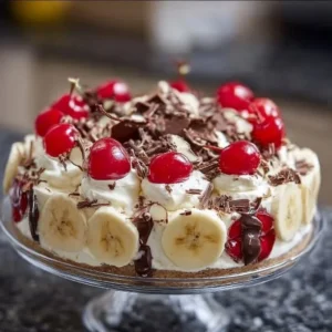 Delicious No Bake Banana Split Cheesecake topped with fresh fruit and whipped cream